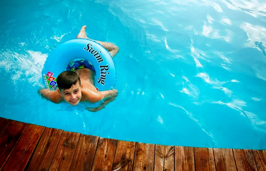 A child floating with a swim ring